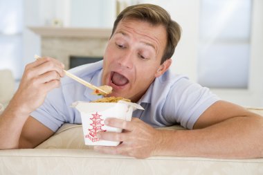 Man Eating Takeaways With Chopsticks clipart