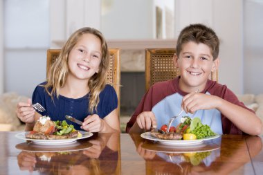 Brother And Sister Eating meal,mealtime Together clipart