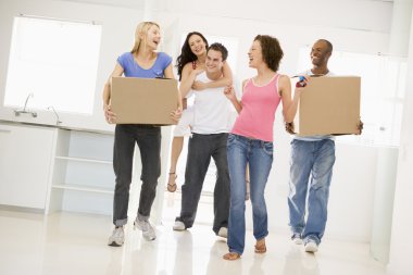 Group of friends moving into new home smiling clipart