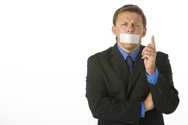 Businessman With His Mouth Taped Shut And Pointing clipart