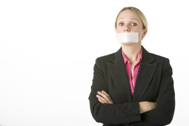 Businesswoman With Her Arms Folded And Mouth Taped Shut clipart