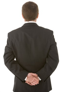 Businessman Holding His Hands Behind His Back clipart