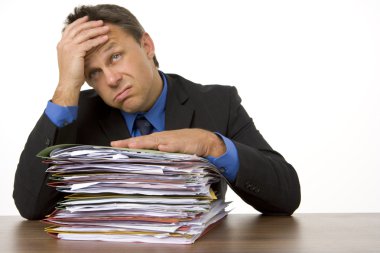 Businessman Overwhelmed By Paperwork clipart