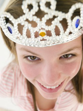 Teenage girl wearing crown and smiling clipart