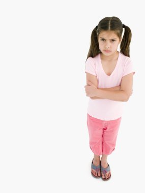Young girl with arms crossed angry clipart