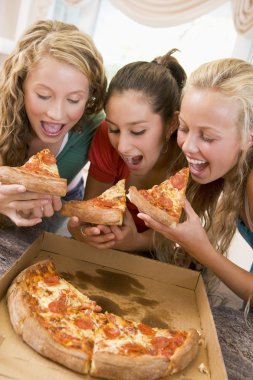 Teenage Girls Eating Pizza clipart