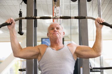 Man Weight Training At Gym clipart