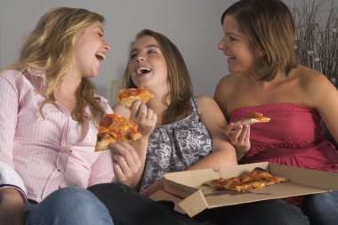 Teenage Girls Eating Pizza clipart