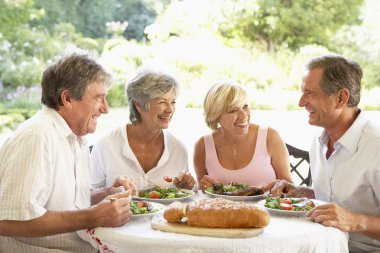 Friends Eating An Al Fresco Lunch clipart