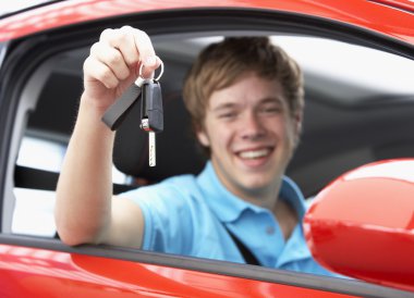 Teenage Boy Sitting In Car Holding Car Keys clipart