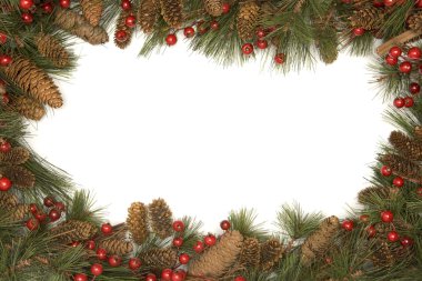 Christmas border of pine branches against white background clipart