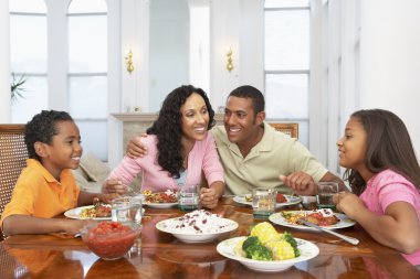 Family Having A Meal Together At Home clipart