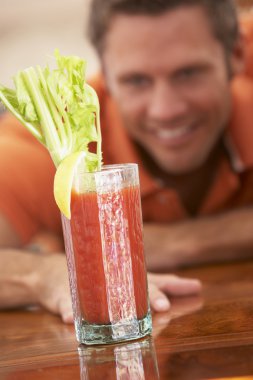 Man Reaching For A Bloody Mary clipart