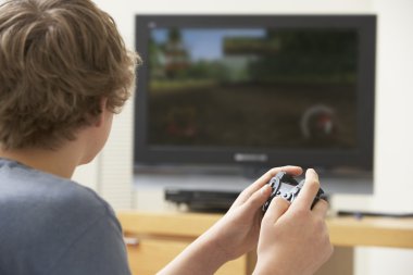 Teenage Boy Playing With Game Console clipart