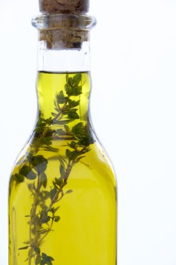 Bottle Of Olive Oil With Herbs clipart