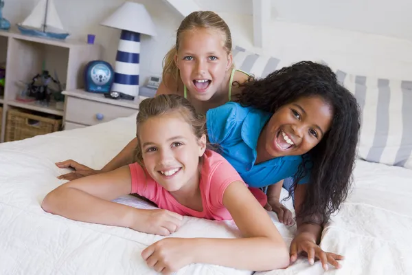 Three Young Friends Lying On Top Of Each Other — Stock Photo, Image