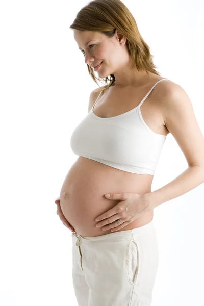 Těhotná Žena Drží Usmívající Nechráněné Břicho — Stock fotografie