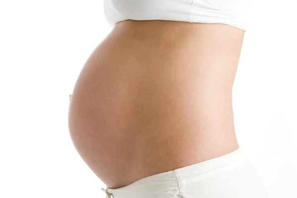 Pregnant woman's exposed belly — Stock Photo, Image