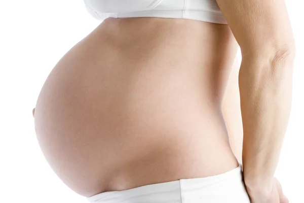 Odkryté břicho těhotné ženy — Stock fotografie