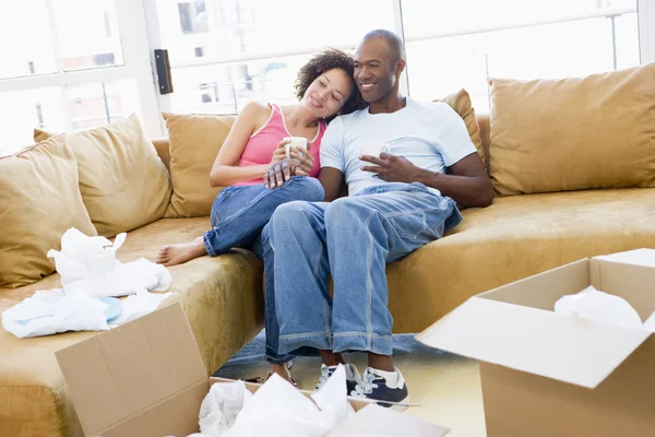 Couple Relaxing Coffee Boxes New Home Smiling — Stock Photo, Image