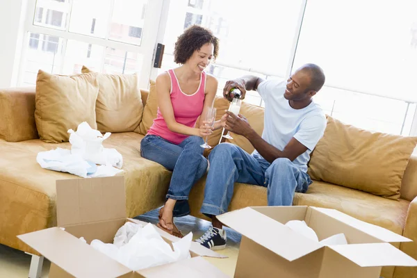 Couple Relaxing Champagne Boxes New Home Smiling — Stock Photo, Image
