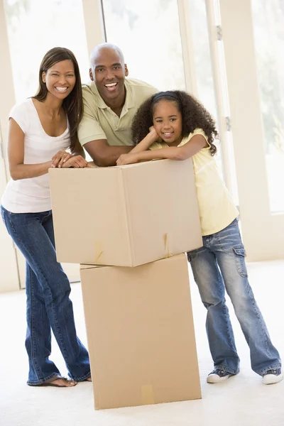 Family Boxes New Home Smiling — Stock Photo, Image