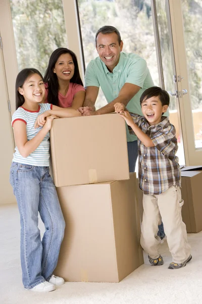 Family Boxes New Home Smiling — Stock Photo, Image