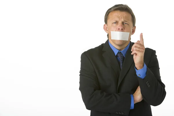 Businessman With His Mouth Taped Shut And Pointing — Stock Photo, Image