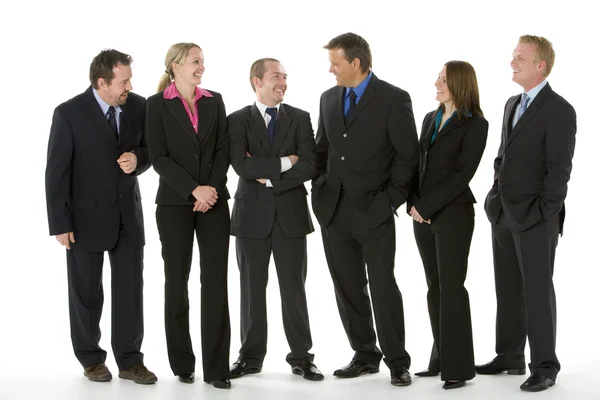Grupo de negócios em pé em torno de conversação — Fotografia de Stock