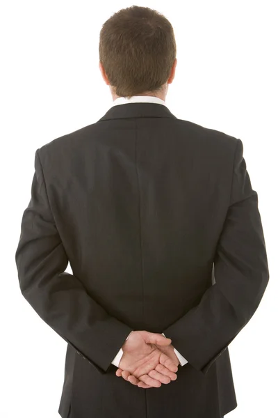 Affärsman som håller händerna bakom ryggen — Stockfoto