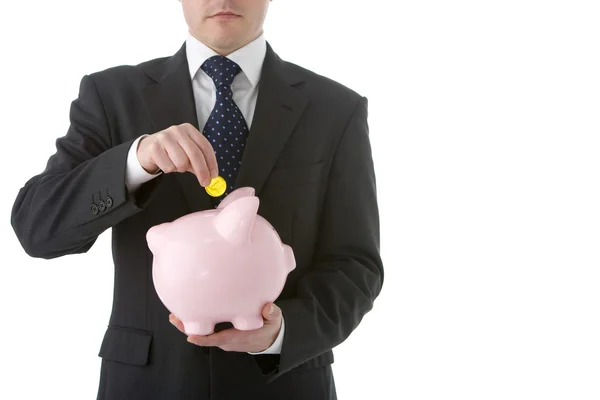Businessman Putting Coin Into Piggy Bank — Stock Photo, Image