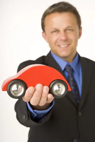Empresário Segurando Carro Brinquedo — Fotografia de Stock