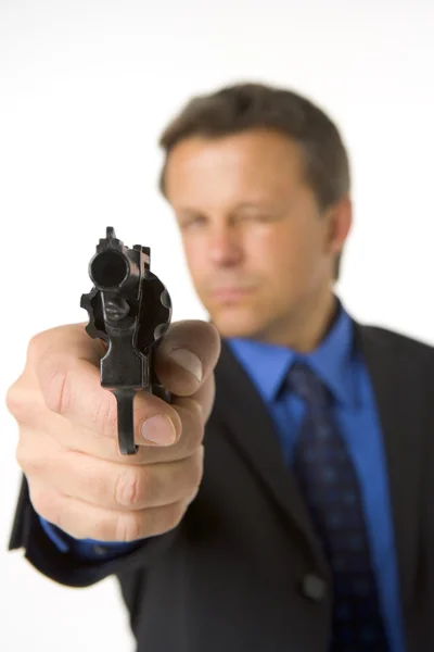 Empresário apontando arma de mão — Fotografia de Stock
