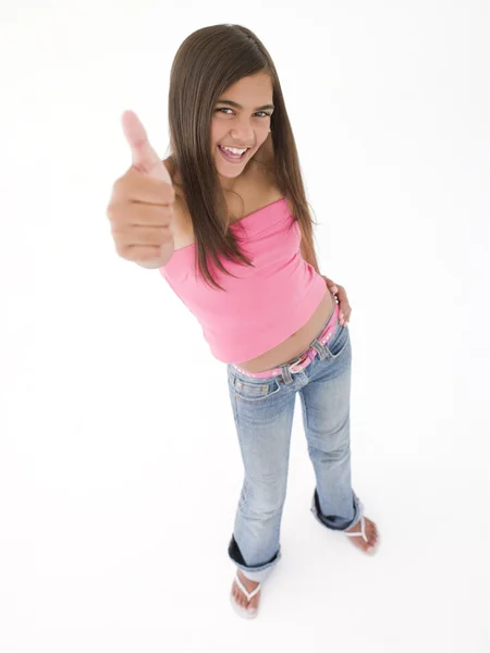 年轻的女孩给微笑着竖起大拇指 — 图库照片