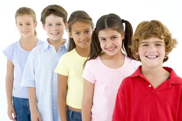 Row of five young friends smiling — Stock Photo, Image