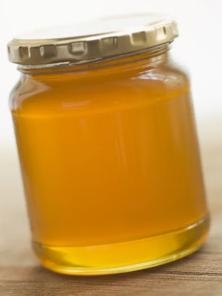 Glas Honig Und Löffel — Stockfoto