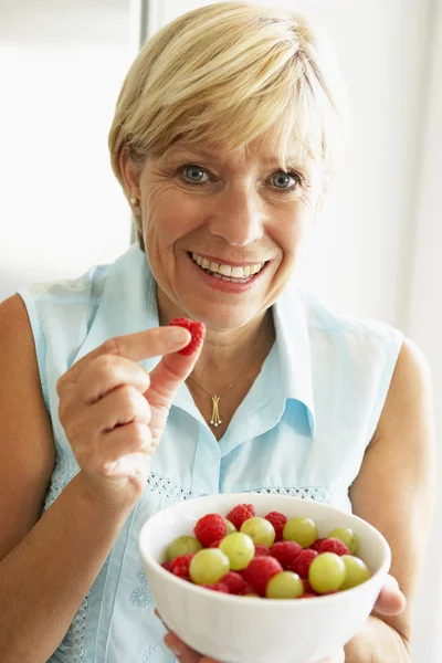 Middle Aged Woman Eating Bowl Fruit — Stock Photo, Image