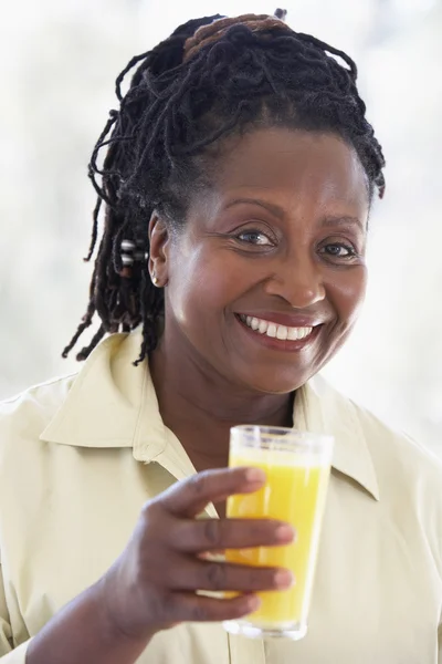 Senior Woman Drinking Fresh Orange Juice — Stock Photo, Image