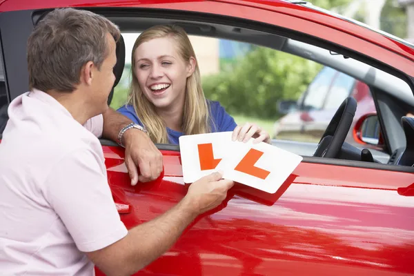 Teenage Girl Receiving Her Learner Plates — Stock Photo, Image