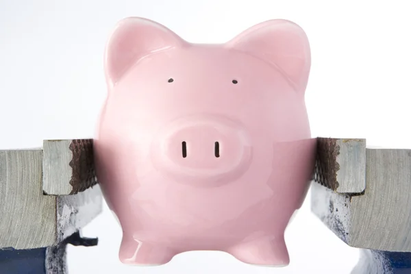 Piggy bank in jaws of vice — Stock Photo, Image