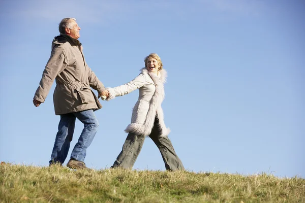 Senior Man Pulling His Wife By The Hand — Stock Photo, Image