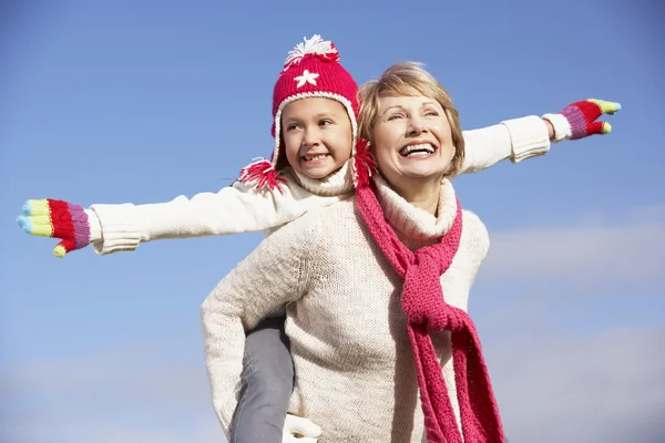 Grandmother Giving Her Granddaughter Piggy Back Ride — Stock Photo, Image