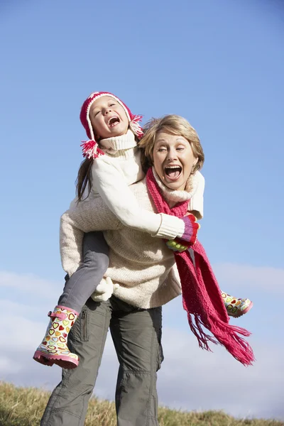 Grandmother Giving Her Granddaughter A Piggy Back Ride — Stock Photo, Image