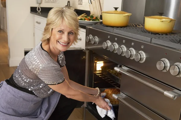 Woman Taking Food Out Oven — Stock Photo, Image