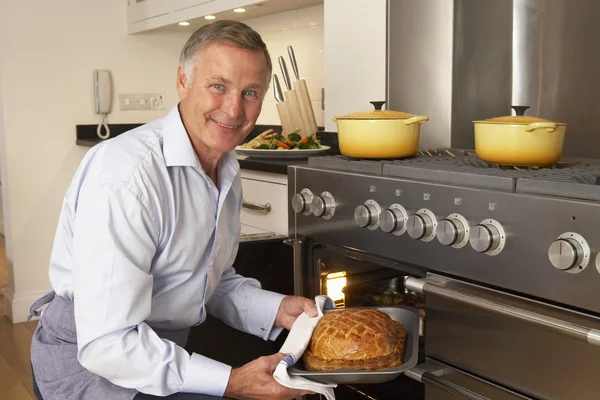 Man Taking Food Out Oven — Stock Photo, Image