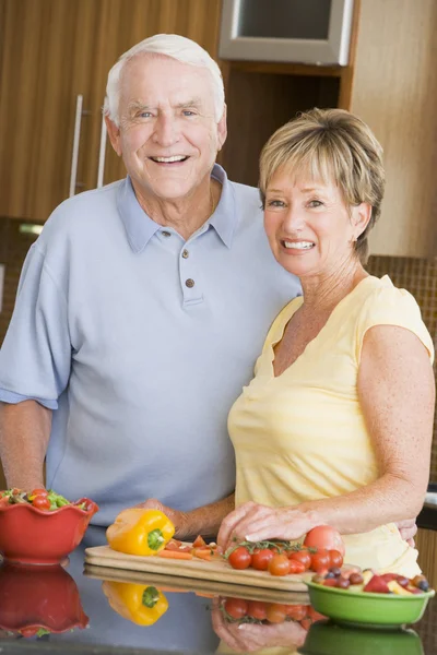 Husband And Wife Preparing Vegetables Stock Image