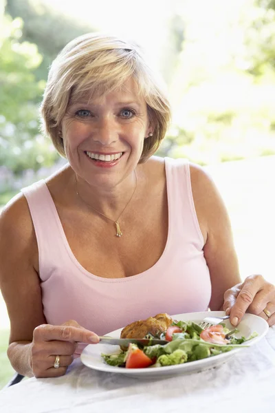 Middle Aged Woman Eating An Al Fresco Lunch Royalty Free Stock Photos