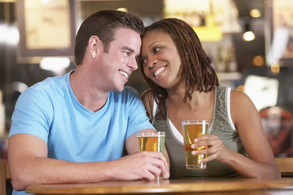 Couple Drinking Beer Together In A Pub Stock Picture