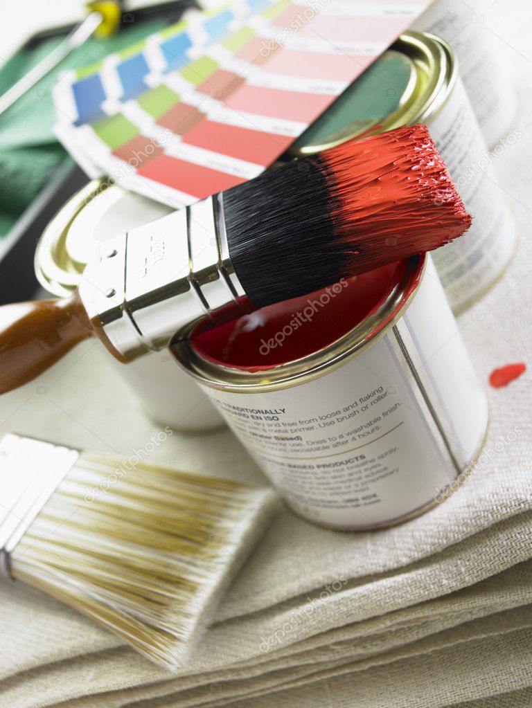 Stack Of Paint Brushes, Paint Tins And Color Wheels — Stock Photo