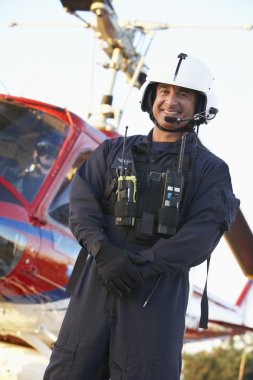 Portrait of paramedic standing in front of Medevac clipart